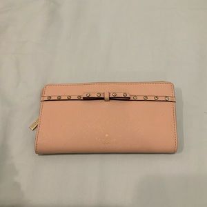 Pink Kate Spade wallet with bow